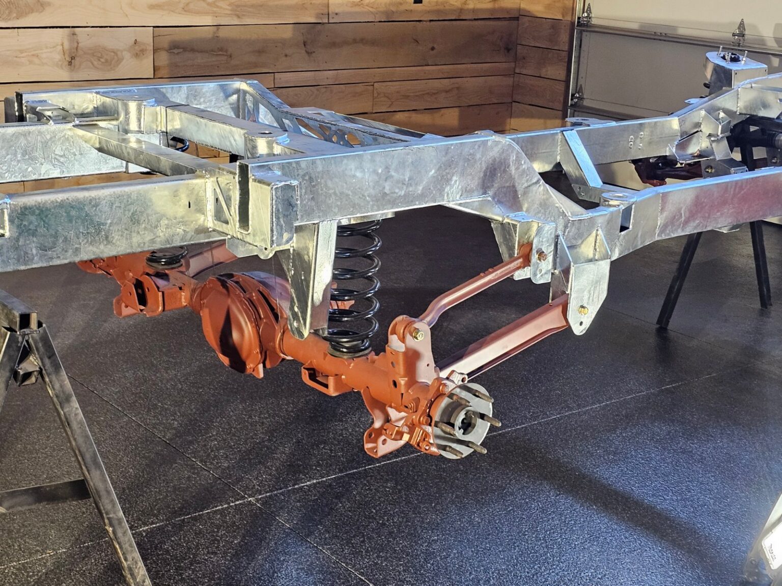 Cast-iron upper control arm on a galvanized Frame-Werx front suspension