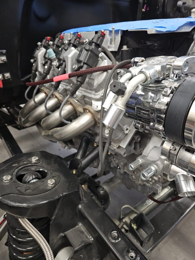 Modern GM V8 with headers and intake installed in a Frame-Werx chassis