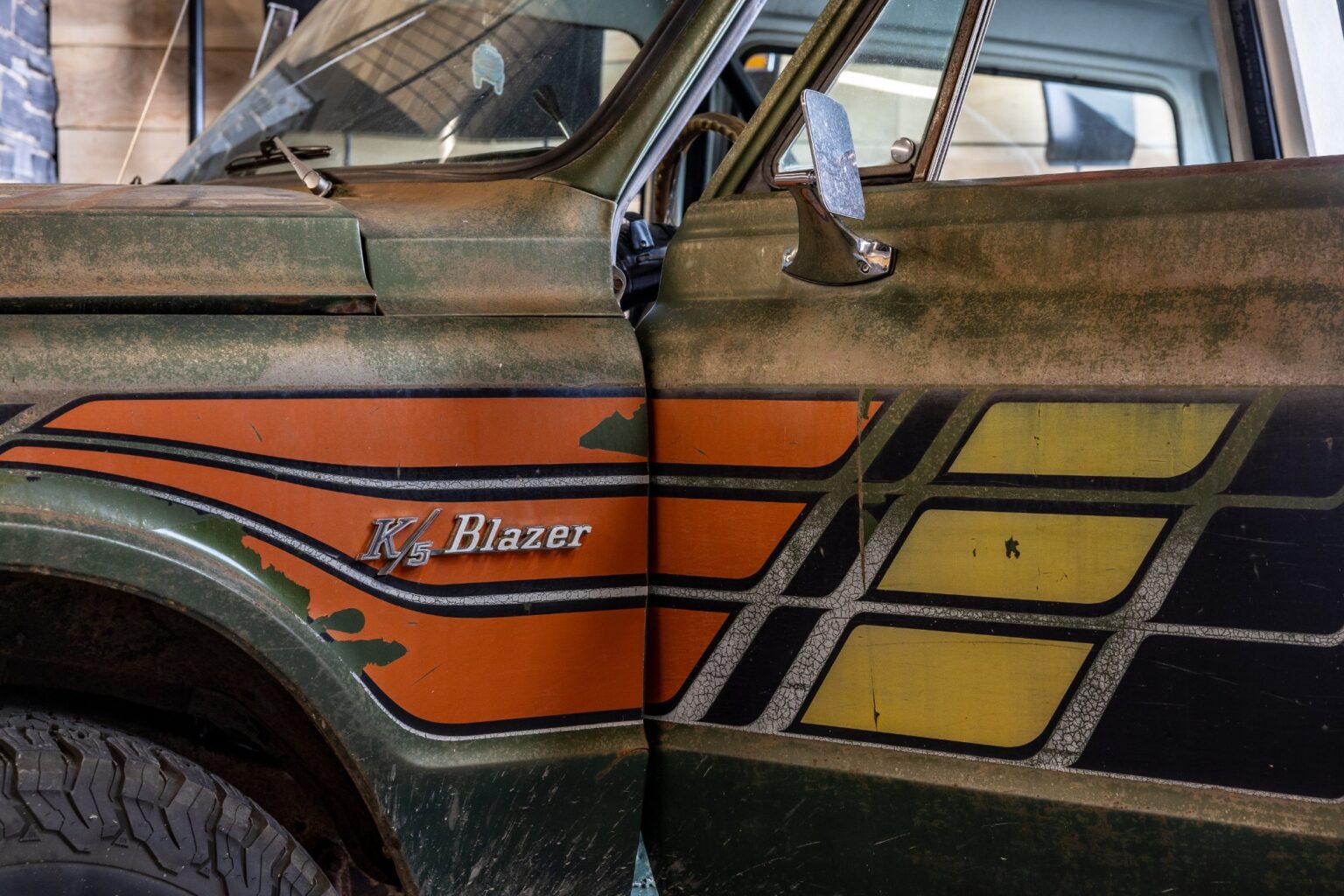 K5 Blazer fender script and orange and gold stripes over original green paint