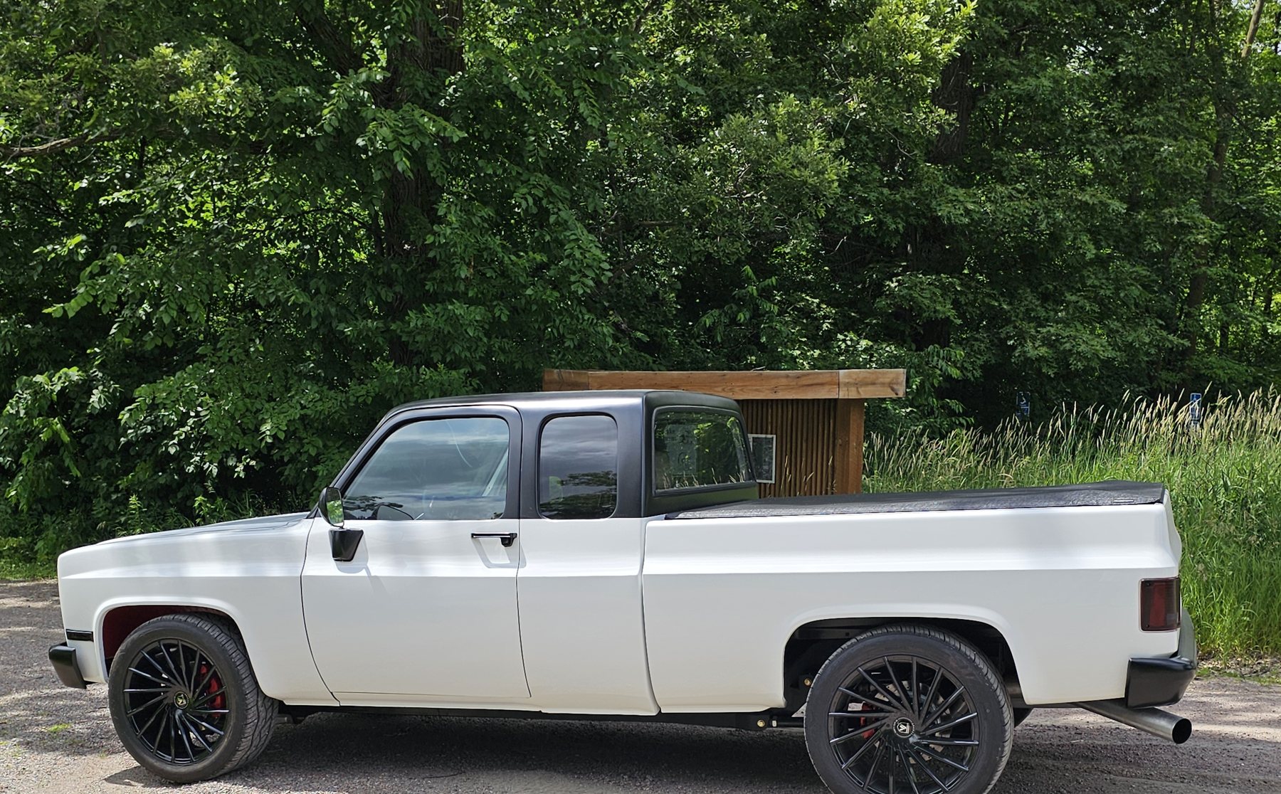 Frame-Werx two-wheel drive chassis under a white 1985 Chevy extended cab pickup