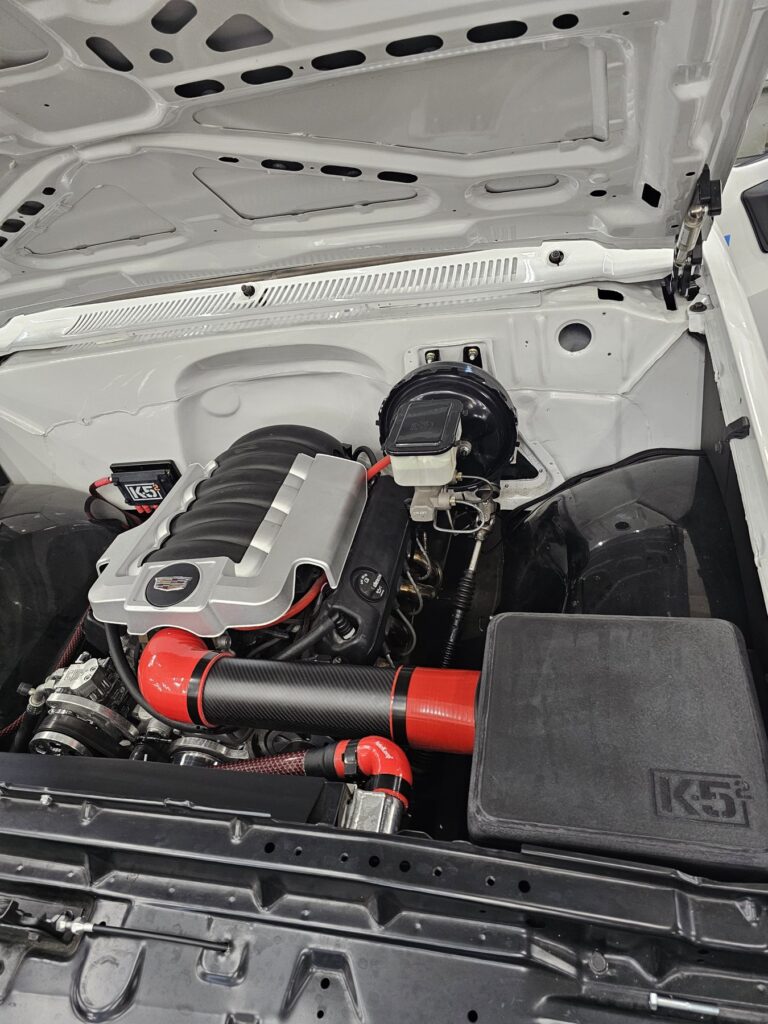Engine bay of the 85 Chevy extended cab with modern GM V8 power